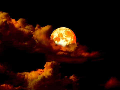 super blood moon in gold sky in night
