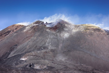 View to primary smoking crater of Etna - tallest active volcano in Europe. Sicily, Italy