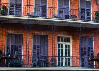 Red Brick And Purple Shutters With Balconies