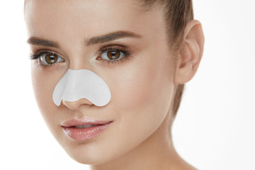 Beautiful Woman Face With Skin Care Patch On Nose