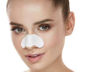 Beautiful Woman Face With Skin Care Patch On Nose