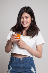 Young Asian woman drink orange juice.