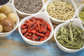 superfood set in small bowls against wood