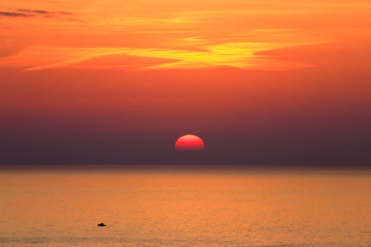 Sunlight like a dove with half sun is downing over the sea, Porto Venere, the province of La Spezia, Italy
