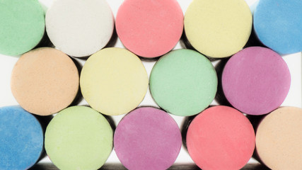Close-up of rows of colorful blackboard chalk background
