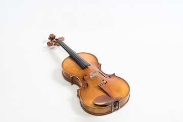 Fototapeta premium The old fiddle, isolated on white background. Viola, Instrument for classical music.