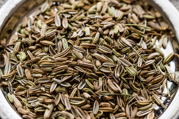 Fennel Seeds on silver plate.