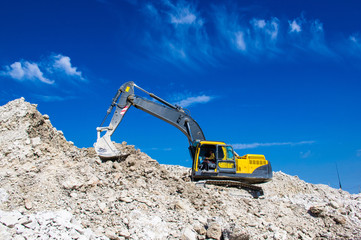 the excavator digging clay