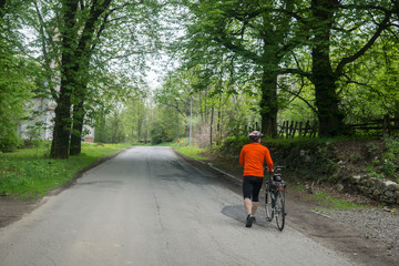 a man rides a bike somewhere in Poland in May 2017