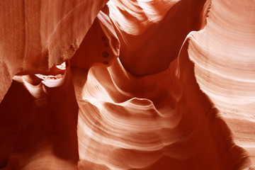 Nature red sandstone textured background good for wallpaper. Swirls of old red  sandstone wall abstract pattern in Lower Antelope Canyon, Page, Arizona, USA.