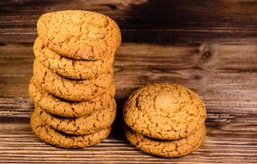 Stack of the oatmeal cookies on wooden table