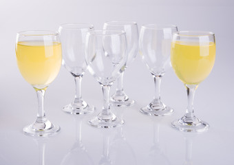 Orange juice in glasses on white background.