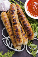 Grilled sausage with sauce and vegetables