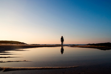 Woman standing on the beach