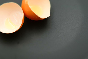 Egg shells on a black background with copy space. Tilt-shift effect applied.