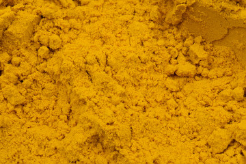 Yellow orange turmeric in powder. Suitable to be used like a background.