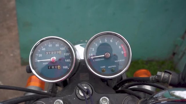 Zoom in of motorcycle speedometer. 4k video