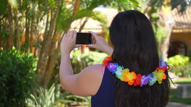 High quality video of woman taking a pictures in Hawaii in real 1080p slow motion 180fps