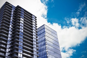 Fototapeta premium Composite image of 3d illustration of modern buildings