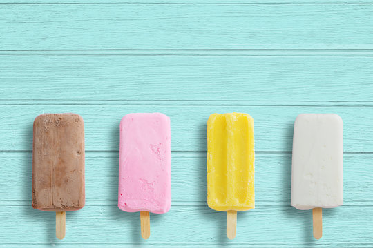 Ice cream stick put on wood background with copy space.