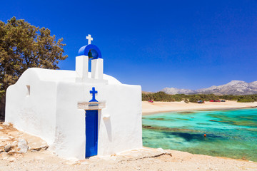 Traditional authentic Greece. Beautiful beach and small church in Naxos island - obrazy, fototapety, plakaty