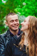 Happy guy looking at his girlfriend. Smiles from the heart