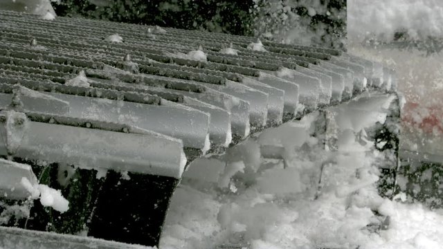 Groomer snow cat churning snow in slow motion