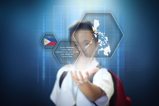 School boy presenting a virtual screen hologram technology of the country Philippines with facts. Isolated blue background with vignette effect. 