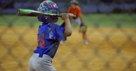 Slow motion of kid batting and running during baseball game - Powered by Adobe
