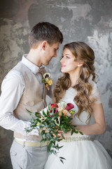 Portrait of a wedding couple in a loft room