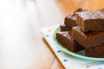 Plate of Chocolate Brownies on Kitchen Table with Copy Space