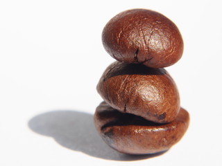 Extreme close up of coffe beans white background