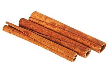Three cinnamon sticks on a white background, close up
