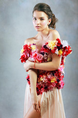 young woman in dress of flowers