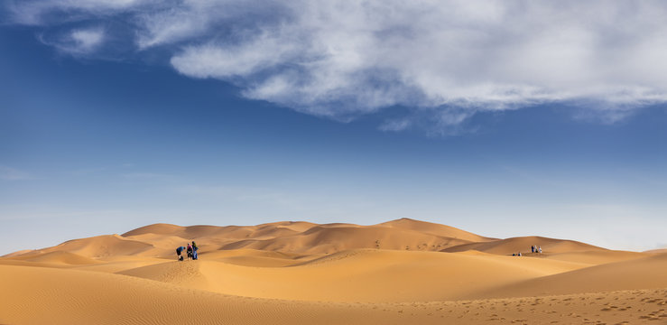 Tourists in sand dunes of Erg Chebby, Merzouga, Morocco