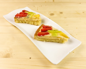 Fruit tart on wooden background - top view