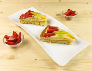 Fruit tart on wooden background - top view