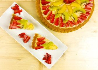 Fruit tart on wooden background - top view