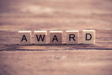 Award word of wooden elements with letter