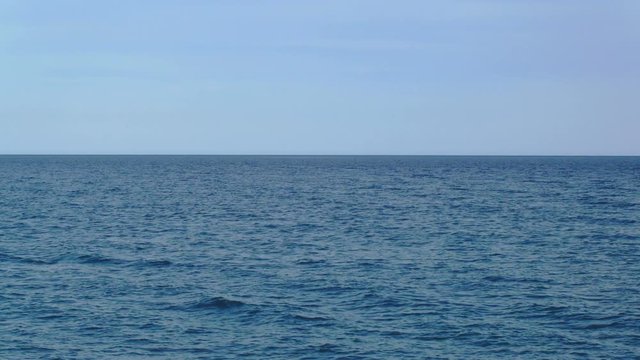 static shot of surface of mediterranean sea, clear blue sky