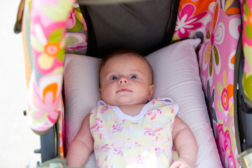 Newborn baby lying in the stroller