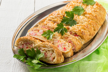 Delicious homemade pie with cheese and surimi