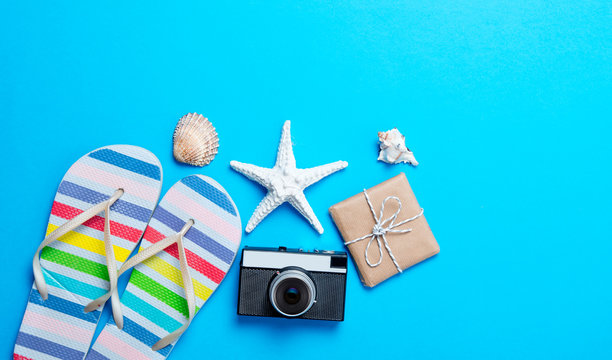 sandals, camera, toy, seashell and gift