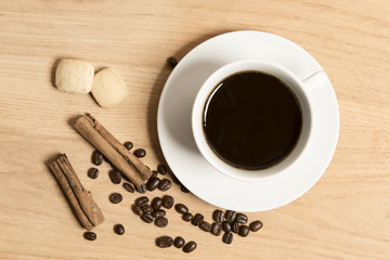 Coffee with coffee beans, cinnamon and biscuits 