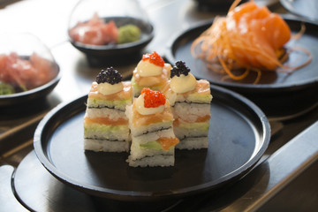 Delicious gourmet sushi and sashimi sandwich with ginger, caviar. Traditional Japanese food.