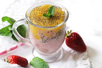 Mango strawberry Chia Seed smoothie on white background, selective focus