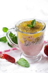 Mango strawberry Chia Seed smoothie on white background, selective focus