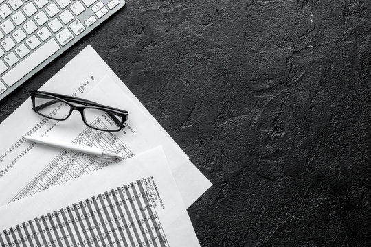 business accounter work with taxes and keyboard on black office desk top view space for text