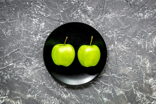 organic food for homemade salad with green apples on dark desk background top view