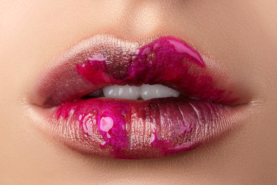 Close up view of beautiful woman lips with modern fashion make up